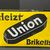 Union Briketts - Heizt Union Briketts (Abgekantetes Schild der 30er Jahre)